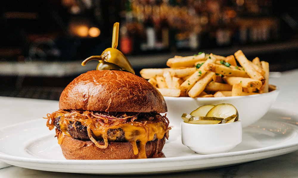 burger and fries on white plate