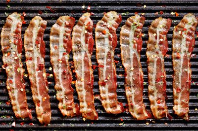 strips of bacon on grill